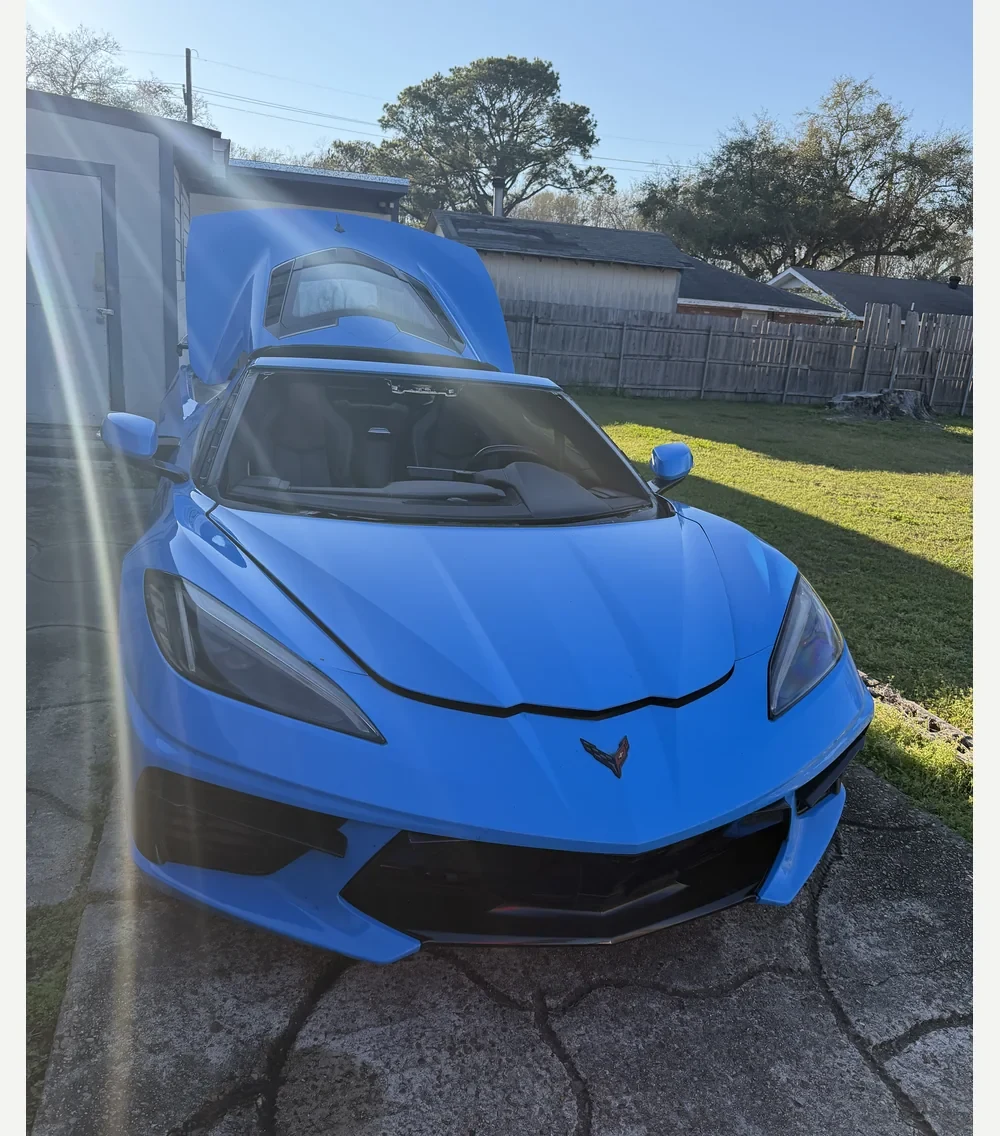Blue Corvette windshield. Windshield removed.